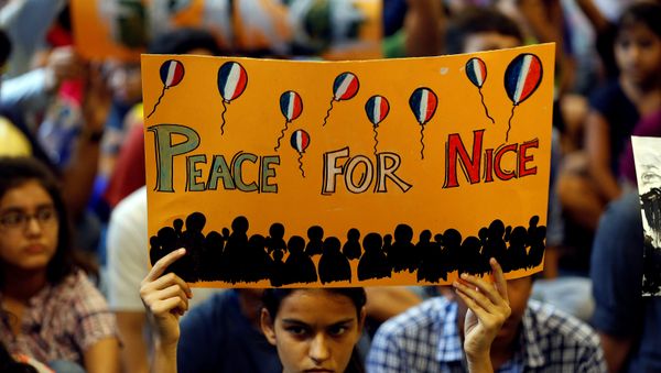 A girl holds up a placard during a prayer meet to show solidarity with the victims of the Bastille Day truck attack in Nice, at a school in Ahmedabad, India, July 15, 2016. A girl holds up a placard during a prayer meet to show solidarity with the victims of the Bastille Day truck attack in Nice, at a school in Ahmedabad, India, July 15, 2016. - Sputnik International