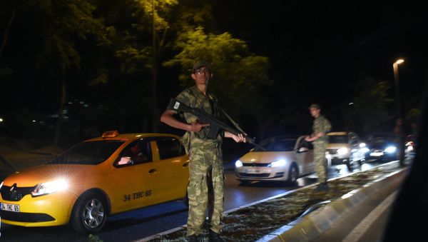 Turkish security officer stands on guard on the side of the road on July 15, 2016 in Istanbul, during a security shutdown of the Bosphorus Bridge. - Sputnik International