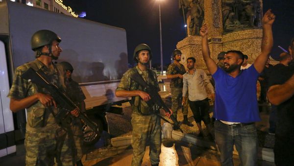 People demonstrate in front of the Republic Monument at the Taksim Square in Istanbul. - Sputnik International