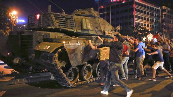 People React Near A Military Vehicle During An Attempted Coup In Ankara People React Near A Military Vehicle During An Attempted Coup In Ankara - Sputnik International