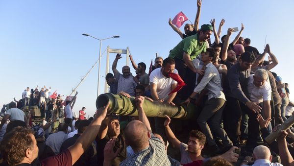 Supporters of Tukish President Tayyip Erdogan celebrate after soldiers involved in the coup surrendered on the Bosphorus Bridge in Istanbul, Turkey July 16, 2016 Supporters of Tukish President Tayyip Erdogan celebrate after soldiers involved in the coup surrendered on the Bosphorus Bridge in Istanbul, Turkey July 16, 2016 - Sputnik International