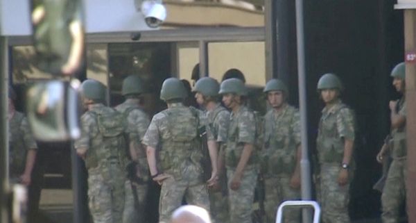still image from video shows armed soldiers waiting at the entrance of TRT state television as they prepare to surrender to the police after a failed coup attempt, in Istanbul, Turkey July 16, 2016 - Sputnik International