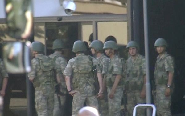still image from video shows armed soldiers waiting at the entrance of TRT state television as they prepare to surrender to the police after a failed coup attempt, in Istanbul, Turkey July 16, 2016 still image from video shows armed soldiers waiting at the entrance of TRT state television as they prepare to surrender to the police after a failed coup attempt, in Istanbul, Turkey July 16, 2016 - Sputnik International