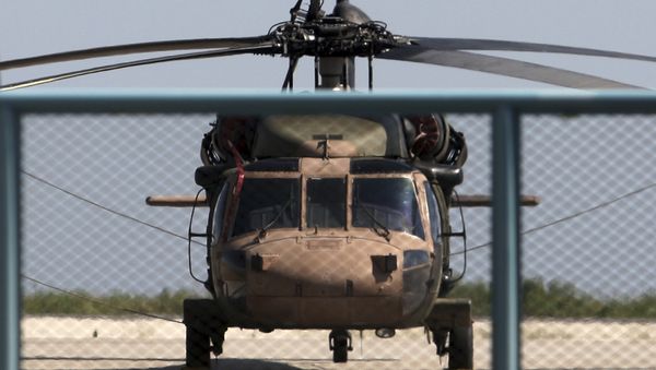 A photo taken on July 16, 2016 shows a Turkish military helicopter at Alexandroupolis airport, after landing there carrying eight officers seeking asylum after a coup bid in Turkey the night before. A photo taken on July 16, 2016 shows a Turkish military helicopter at Alexandroupolis airport, after landing there carrying eight officers seeking asylum after a coup bid in Turkey the night before. - Sputnik International