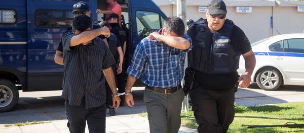 Two of the eight Turkish soldiers who fled to Greece in a helicopter and requested political asylum after a failed military coup against the government, are brought to prosecutor by two policemen in the northern Greek city of Alexandroupolis, Greece, July 17, 2016. Two of the eight Turkish soldiers who fled to Greece in a helicopter and requested political asylum after a failed military coup against the government, are brought to prosecutor by two policemen in the northern Greek city of Alexandroupolis, Greece, July 17, 2016. - Sputnik International