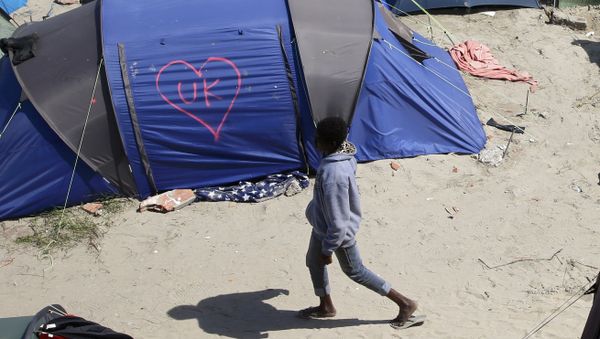 A heart and UK symbol are marked on the side of a tent as a migrant walks in the make-shift camp, called the jungle, in Calais, France, after Britain's referendum results to leave the European Union were announced June 24, 2016. A heart and UK symbol are marked on the side of a tent as a migrant walks in the make-shift camp, called the jungle, in Calais, France, after Britain's referendum results to leave the European Union were announced June 24, 2016. - Sputnik International
