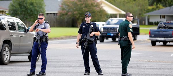 Police officers block off a road after a shooting of police in Baton Rouge, Louisiana, U.S. July 17, 2016. Police officers block off a road after a shooting of police in Baton Rouge, Louisiana, U.S. July 17, 2016. - Sputnik International