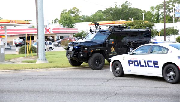Police officers block off a road after a shooting of police in Baton Rouge, Louisiana, U.S. July 17, 2016. - Sputnik International
