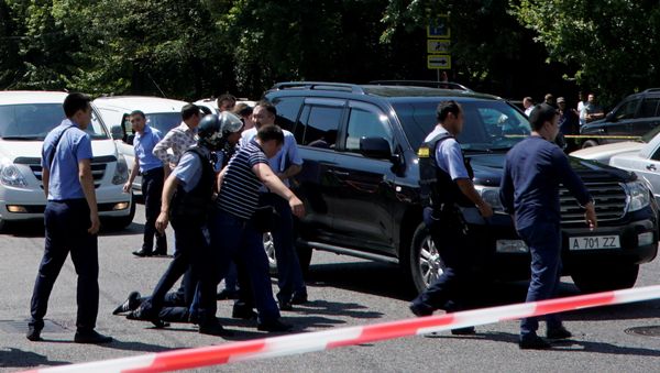 Police officers detain a man after an attack in the centre of Almaty, Kazakhstan, July 18, 2016. Police officers detain a man after an attack in the centre of Almaty, Kazakhstan, July 18, 2016. - Sputnik International