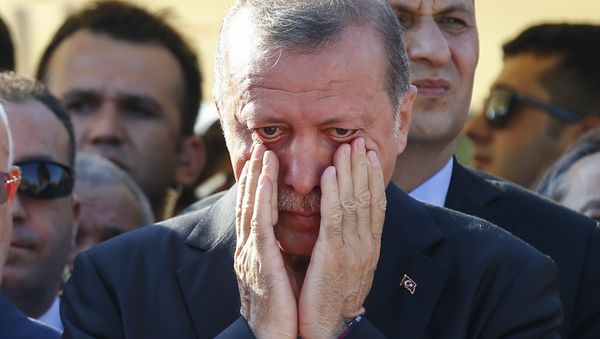 Turkish President Recep Tayyip Erdogan right, wipes his tears during the funeral of Mustafa Cambaz, Erol and Abdullah Olcak, killed Friday while protesting the attempted coup against Turkey's government, in Istanbul, Sunday, July 17, 2016. Turkish President Recep Tayyip Erdogan right, wipes his tears during the funeral of Mustafa Cambaz, Erol and Abdullah Olcak, killed Friday while protesting the attempted coup against Turkey's government, in Istanbul, Sunday, July 17, 2016. - Sputnik International