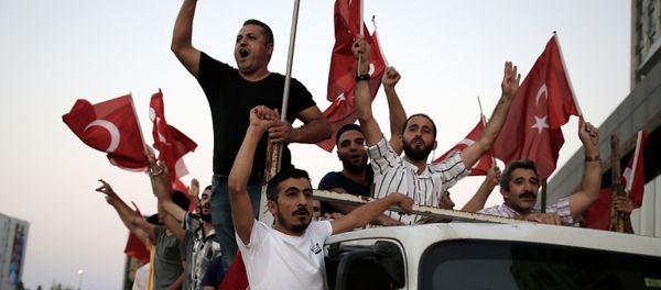 Supporters of Turkish President Tayyip Erdogan shout slogans on the back of a truck during a pro-government demonstration on Taksim square in Istanbul, Turkey, July 16, 2016. Supporters of Turkish President Tayyip Erdogan shout slogans on the back of a truck during a pro-government demonstration on Taksim square in Istanbul, Turkey, July 16, 2016. - Sputnik International