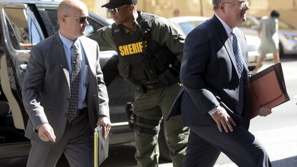 Lt. Brian Rice, left, one of the six members of the Baltimore Police Department charged in connection to the death of Freddie Gray, arrives with attorney Mike Davey, right, at a courthouse to hear a judge's ruling in his trial in Baltimore, Monday, July 18, 2016. - Sputnik International