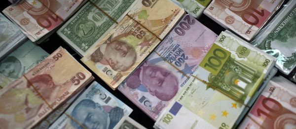 Turkish Liras, Euros and U.S. Dollars are stacked at a currency exchange office in Istanbul, Turkey (File) Turkish Liras, Euros and U.S. Dollars are stacked at a currency exchange office in Istanbul, Turkey (File) - Sputnik International
