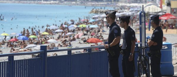 French police officers patrol on the famed Promenade des Anglais in Nice, southern France, three days after a truck mowed through revelers, Sunday, July 17, 2016. French police officers patrol on the famed Promenade des Anglais in Nice, southern France, three days after a truck mowed through revelers, Sunday, July 17, 2016. - Sputnik International