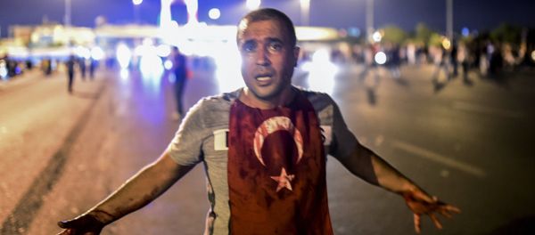 A man covered with blood stands near the Bosphorus bridge as Turkish military clash with people at the entrance to the bridge in Istanbul on July 16, 2016 A man covered with blood stands near the Bosphorus bridge as Turkish military clash with people at the entrance to the bridge in Istanbul on July 16, 2016 - Sputnik International
