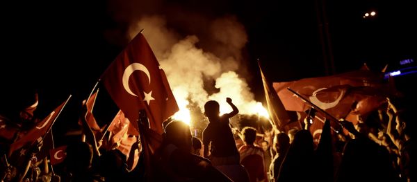 Pro-Erdogan supporters wave Turkish national flags during a rally at Taksim square in Istanbul on July 18, 2016 following the military failed coup attempt of July 15 - Sputnik International
