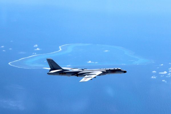 In this undated photo released by Xinhua News Agency, a Chinese H-6K bomber patrols the islands and reefs in the South China Sea. In this undated photo released by Xinhua News Agency, a Chinese H-6K bomber patrols the islands and reefs in the South China Sea. - Sputnik International