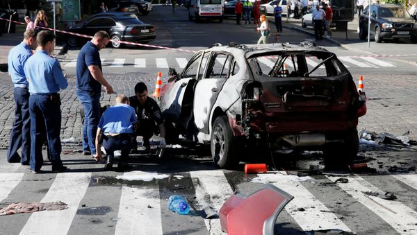 Investigators at the site where journalist Pavel Sheremet was killed by a car bomb in central Kiev, Ukraine, July 20, 2016 - Sputnik International