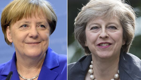This combination of pictures created on July 13, 2016 shows (R) Britain's Home Secretary and new leader of the Conservative Party Theresa May arriving in Downing Street in London on July 12, 2016 and German Chancellor Angela Merkel smiling as she addresses the media at the end of the second day of an EU - Summit at the EU headquarters in Brussels on June 29, 2016. This combination of pictures created on July 13, 2016 shows (R) Britain's Home Secretary and new leader of the Conservative Party Theresa May arriving in Downing Street in London on July 12, 2016 and German Chancellor Angela Merkel smiling as she addresses the media at the end of the second day of an EU - Summit at the EU headquarters in Brussels on June 29, 2016. - Sputnik International