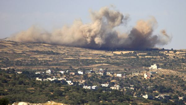A picture taken from the Israeli-annexed Golan Heights shows smoke rising from the Syrian Druze village of Hader, on June 16, 2015 A picture taken from the Israeli-annexed Golan Heights shows smoke rising from the Syrian Druze village of Hader, on June 16, 2015 - Sputnik International