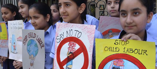 Indian students hold placards during a demonstration against 'child labour' Indian students hold placards during a demonstration against 'child labour' - Sputnik International