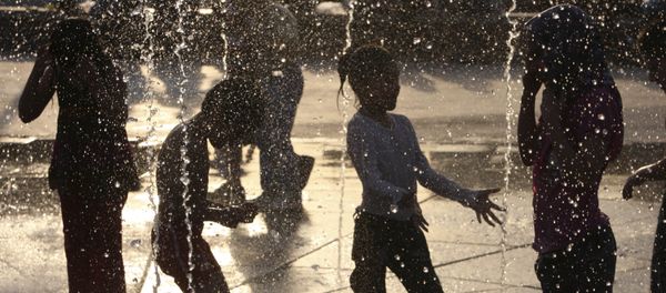 Iranian children enjoy a water fountain, while temperatures reach over 35 Celsius (95 Fahrenheit), at the Ebrahim (Abraham) Park in Tehran, Iran, Wednesday, July 13, 2011 Iranian children enjoy a water fountain, while temperatures reach over 35 Celsius (95 Fahrenheit), at the Ebrahim (Abraham) Park in Tehran, Iran, Wednesday, July 13, 2011 - Sputnik International