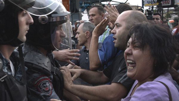 Armenian opposition supporters clash with riot police blocking the streets to Erebuni police station, where gunmen are holding hostages, in Yerevan on July 19, 2016 Armenian opposition supporters clash with riot police blocking the streets to Erebuni police station, where gunmen are holding hostages, in Yerevan on July 19, 2016 - Sputnik International