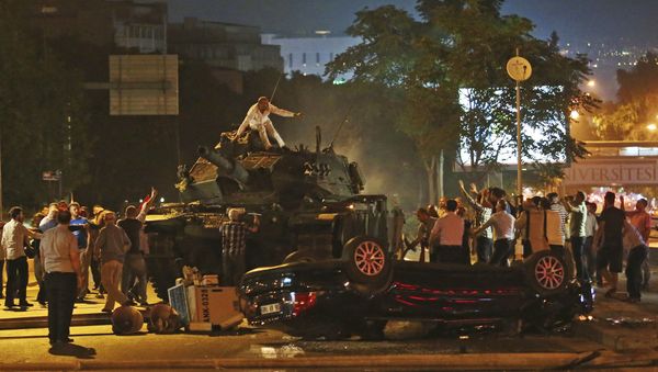 In this July 16, 2016, file photo, tanks move into position as Turkish people attempt to stop them in Ankara, Turkey - Sputnik International
