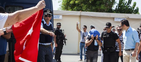 A Turkish military officer is transferred to a court hall in the city of Alexandroupolis, northern Greece, Thursday, July 21, 2016 - Sputnik International