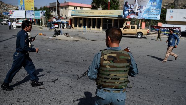 Afghan security personnel arrive after a suicide attack that targeted crowds of minority Shiite Hazaras during a demonstration at the Deh Mazang Circle of Kabul on July 23, 2016. Afghan security personnel arrive after a suicide attack that targeted crowds of minority Shiite Hazaras during a demonstration at the Deh Mazang Circle of Kabul on July 23, 2016. - Sputnik International