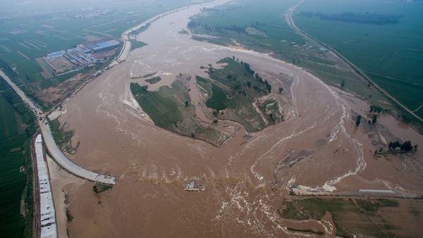 An aerial view shows that roads and fields are flooded in Xingtai, Hebei Province, China - Sputnik International