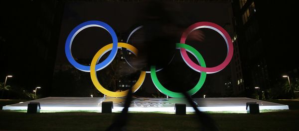 A woman walks past Olympic rings placed at the entrance of a office building ahead of the Rio 2016 Olympic Games, in Sao Paulo, Brazil, July 19, 2016. A woman walks past Olympic rings placed at the entrance of a office building ahead of the Rio 2016 Olympic Games, in Sao Paulo, Brazil, July 19, 2016. - Sputnik International
