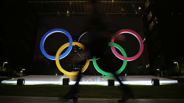 A woman walks past Olympic rings placed at the entrance of a office building ahead of the Rio 2016 Olympic Games, in Sao Paulo, Brazil, July 19, 2016. A woman walks past Olympic rings placed at the entrance of a office building ahead of the Rio 2016 Olympic Games, in Sao Paulo, Brazil, July 19, 2016. - Sputnik International
