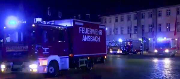 In this image taken from video fire trucks and ambulances stand in the city center of Ansbach near Nuremberg, southern Germany, Monday morning, July 25, 2016, after a man was killed when an explosive device he was believed to be carrying went off near an open-air music festival, injuring 12 others. In this image taken from video fire trucks and ambulances stand in the city center of Ansbach near Nuremberg, southern Germany, Monday morning, July 25, 2016, after a man was killed when an explosive device he was believed to be carrying went off near an open-air music festival, injuring 12 others. - Sputnik International
