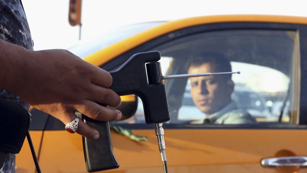 In this Thursday, July 14, 2016 picture, an Iraqi policeman uses a hand-held device that is supposed to detect bombs at a checkpoint in Basra, 340 miles (550 kilometers) southeast of Baghdad, Iraq. In this Thursday, July 14, 2016 picture, an Iraqi policeman uses a hand-held device that is supposed to detect bombs at a checkpoint in Basra, 340 miles (550 kilometers) southeast of Baghdad, Iraq. - Sputnik International