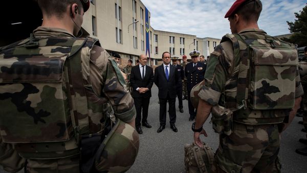 French President Francois Hollande (R) and Defence Minister Jean-Yves Le Drian review troops at the Army base and command centre for France's 'Vigipirate' plan, dubbed 'Operation Sentinelle', at the fort of Vincennes, on the outskirts of Paris, France, July 25, 2016 French President Francois Hollande (R) and Defence Minister Jean-Yves Le Drian review troops at the Army base and command centre for France's 'Vigipirate' plan, dubbed 'Operation Sentinelle', at the fort of Vincennes, on the outskirts of Paris, France, July 25, 2016 - Sputnik International