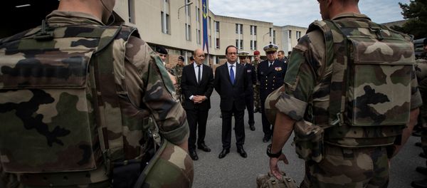 French President Francois Hollande (R) and Defence Minister Jean-Yves Le Drian review troops at the Army base and command centre for France's 'Vigipirate' plan, dubbed 'Operation Sentinelle', at the fort of Vincennes, on the outskirts of Paris, France, July 25, 2016 French President Francois Hollande (R) and Defence Minister Jean-Yves Le Drian review troops at the Army base and command centre for France's 'Vigipirate' plan, dubbed 'Operation Sentinelle', at the fort of Vincennes, on the outskirts of Paris, France, July 25, 2016 - Sputnik International