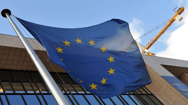 EU flag is seen in front of the EU Commission Headquarters in Brussels. (File) EU flag is seen in front of the EU Commission Headquarters in Brussels. (File) - Sputnik International