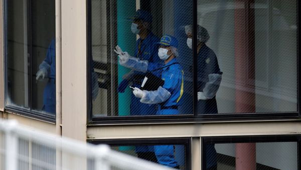 Police officers investigate at a facility for the disabled, where a deadly attack by a knife-wielding man took place, in Sagamihara, Kanagawa prefecture, Japan, July 26, 2016. - Sputnik International