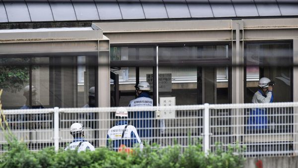 Rescue workers are seen in a facility for the disabled, where a deadly attack by a knife-wielding man took place, in Sagamihara, Kanagawa prefecture, Japan, in this photo taken by Kyodo July 26, 2016. - Sputnik International