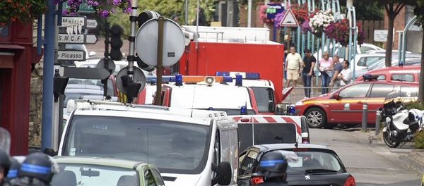 Police and rescue workers stand at the scene after two assailants had taken five people hostage in the church at Saint-Etienne-du -Rouvray near Rouen in Normandy, France - Sputnik International
