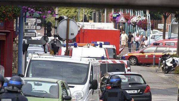 Police and rescue workers stand at the scene after two assailants had taken five people hostage in the church at Saint-Etienne-du -Rouvray near Rouen in Normandy, France - Sputnik International