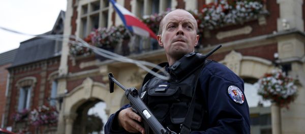A policeman secures a position in front of the city hall after two assailants had taken five people hostage in the church at Saint-Etienne-du -Rouvray near Rouen in Normandy, France, July 26, 2016. A policeman secures a position in front of the city hall after two assailants had taken five people hostage in the church at Saint-Etienne-du -Rouvray near Rouen in Normandy, France, July 26, 2016. - Sputnik International