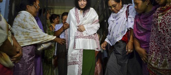 In this Wednesday, Aug. 20, 2014 photo, Irom Sharmila, center, walks out of a security ward after her release in Porompal district, in Imphal, India. In this Wednesday, Aug. 20, 2014 photo, Irom Sharmila, center, walks out of a security ward after her release in Porompal district, in Imphal, India. - Sputnik International