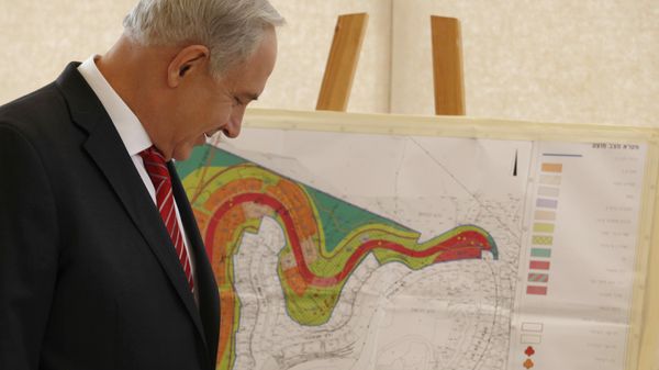 Israeli Prime Minister Benjamin Netanyahu looks at a map of the area where Israel plans to build some 800 new housing units during his visit to the east Jerusalem Jewish neighborhood of Gilo. Israeli Prime Minister Benjamin Netanyahu looks at a map of the area where Israel plans to build some 800 new housing units during his visit to the east Jerusalem Jewish neighborhood of Gilo. - Sputnik International