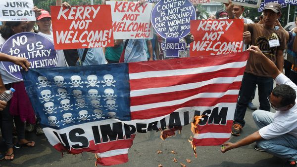 Activists burn a mock US flag during a protest at the US embassy, to coincide with US Secretary of State John Kerry's visit to the Philippines in Manila on July 27, 2016 Activists burn a mock US flag during a protest at the US embassy, to coincide with US Secretary of State John Kerry's visit to the Philippines in Manila on July 27, 2016 - Sputnik International