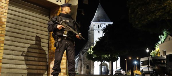French riot police guards the street to access the church where an hostage taking left a priest dead in Saint-Etienne-du-Rouvray, Normandy, France, Tuesday, July 26, 2016 - Sputnik International