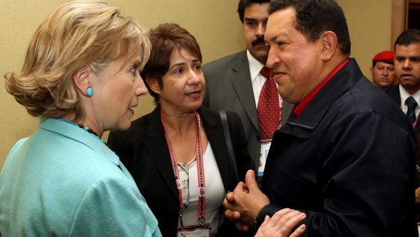 Venezuelan President Hugo Chavez listens to US Secretary of State Hilary Clinton during the Summit of the Americas in 2009 Venezuelan President Hugo Chavez listens to US Secretary of State Hilary Clinton during the Summit of the Americas in 2009 - Sputnik International
