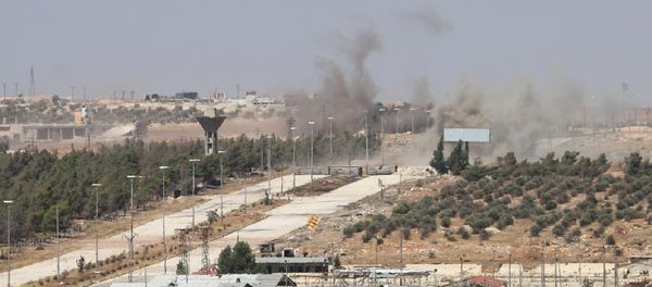 Smoke billows near Castello road leading to Bani Zeid during an operation by Syrian government forces to retake control of the rebel-held district of Leramun, on the northwest outskirts of Aleppo, on July 26, 2016 - Sputnik International