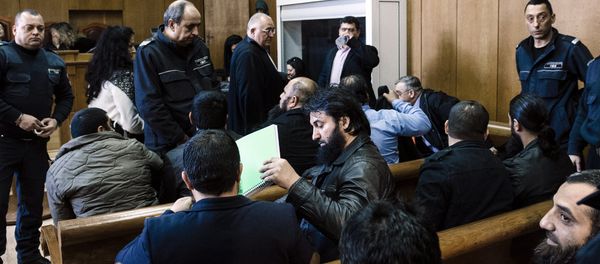 Bulgarian Roma men charged with preaching practising an ultraconservative form of Islam sit before the start of their trial at the court of Pazardzhik on February 25, 2016 Bulgarian Roma men charged with preaching practising an ultraconservative form of Islam sit before the start of their trial at the court of Pazardzhik on February 25, 2016 - Sputnik International